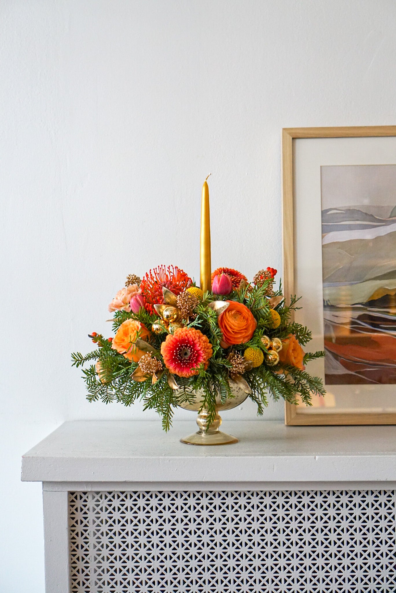 An arrangement that evokes that warm and fuzzy feelings. Featuring pin cushions, gerbpom, free spirit roses, ranunculus, double tulips, golden ilex, golden sprayed skimmia.The Flower Nook. Toronto Florist