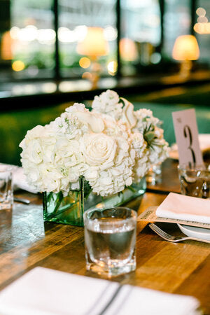 This centrepiece is designed in a 12" glass rectangle vase. It looks beautiful on its own, or in pairs with a small trios for those longer tables. Flower Nook - Toronto Florist