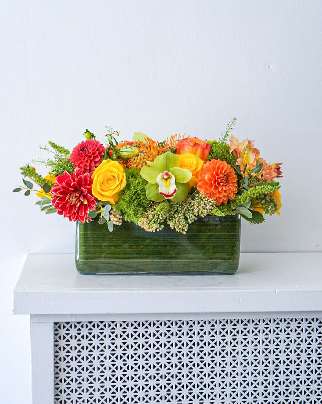 Harvest Centrepiece - Make fall shimmer with this glorious assorted of autumnal blooms, arranged in a modern rectangular vase.