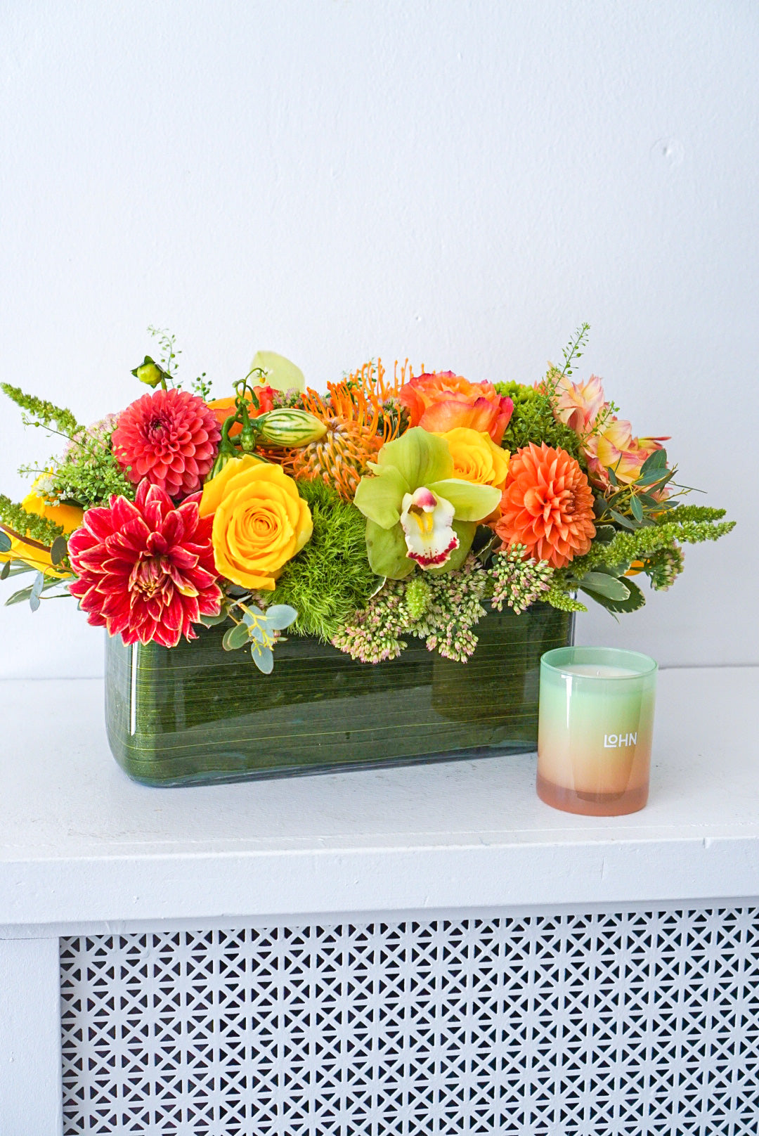 Harvest Centrepiece - Make fall shimmer with this glorious assorted of autumnal blooms, arranged in a modern rectangular vase.