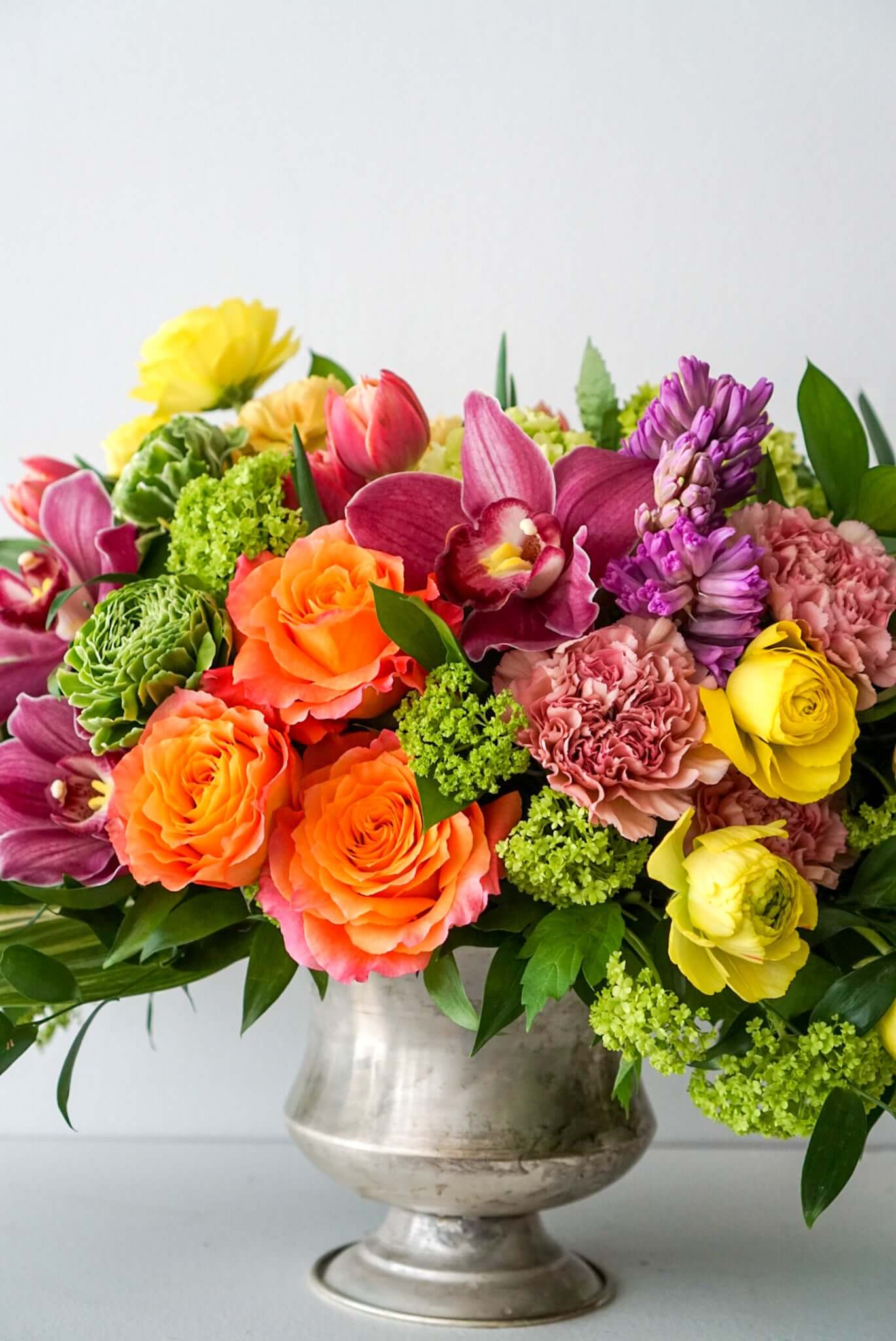 A sophisticated and tasteful arrangement for the fall season. The Autumn Festival filled with autumn elements include Free Spirit roses, dahlias, hyacinth, cymbidium orchids...The Flower Nook, Toronto Florist