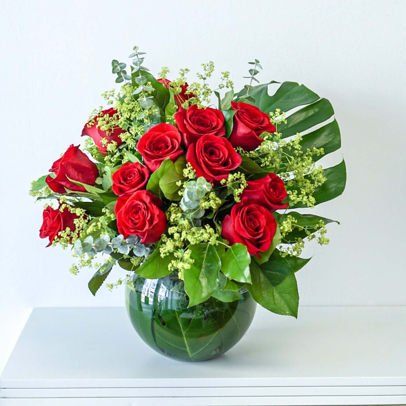 Sweetheart roses - A dozen of red roses and seasonal fillers in fish bowl vase. The Flower Nook - Toronto Florist