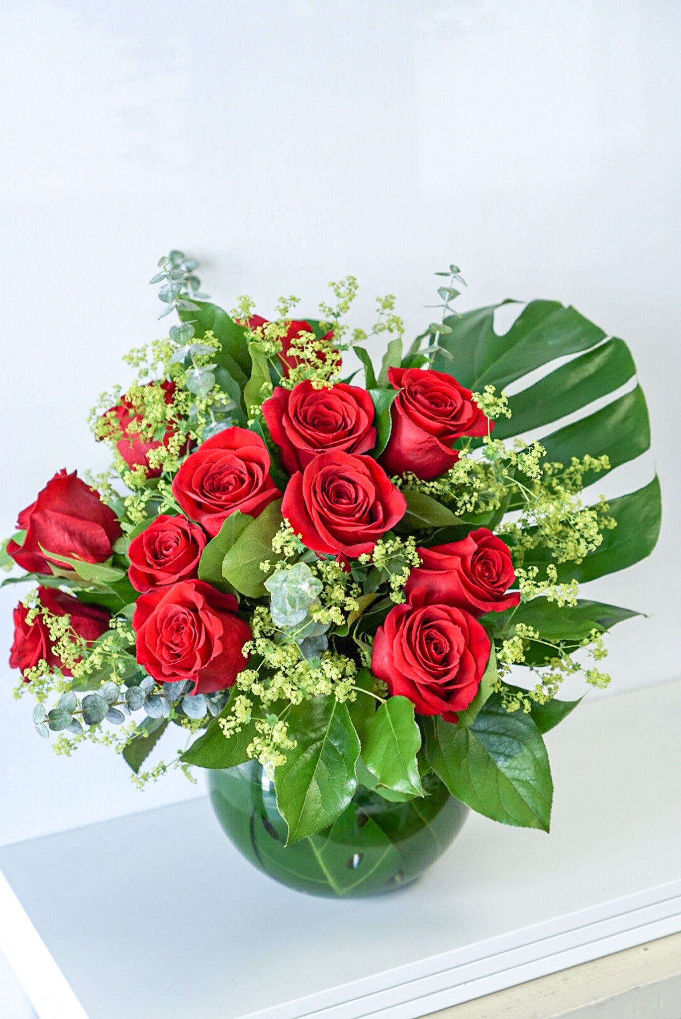 Sweetheart roses - A dozen of red roses and seasonal fillers in fish bowl vase. The Flower Nook - Toronto Florist