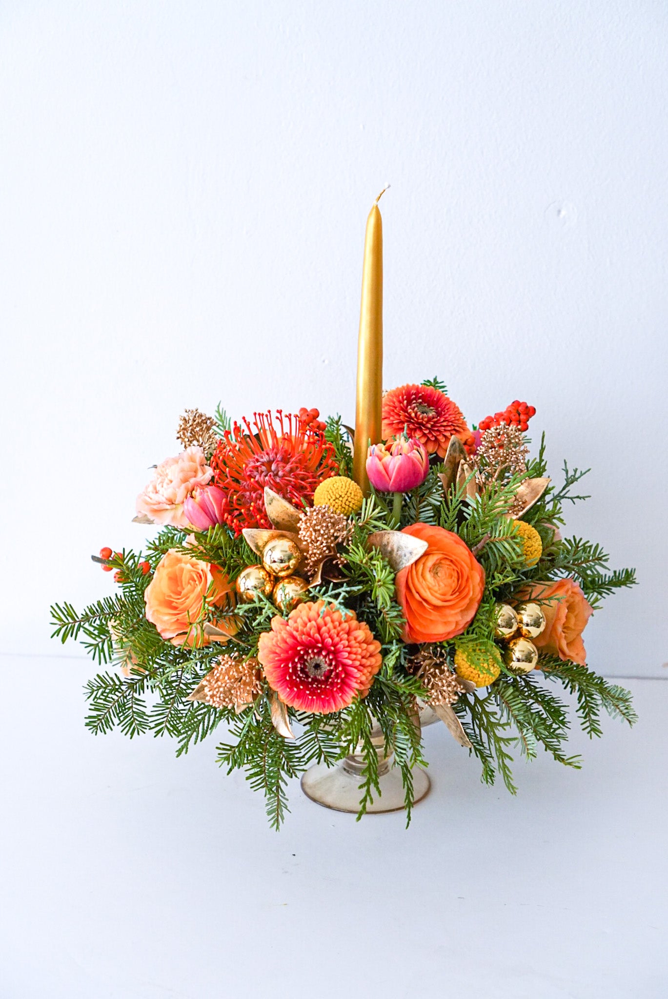 An arrangement that evokes that warm and fuzzy feelings. Featuring pin cushions, gerbpom, free spirit roses, ranunculus, double tulips, golden ilex, golden sprayed skimmia.The Flower Nook. Toronto Florist 