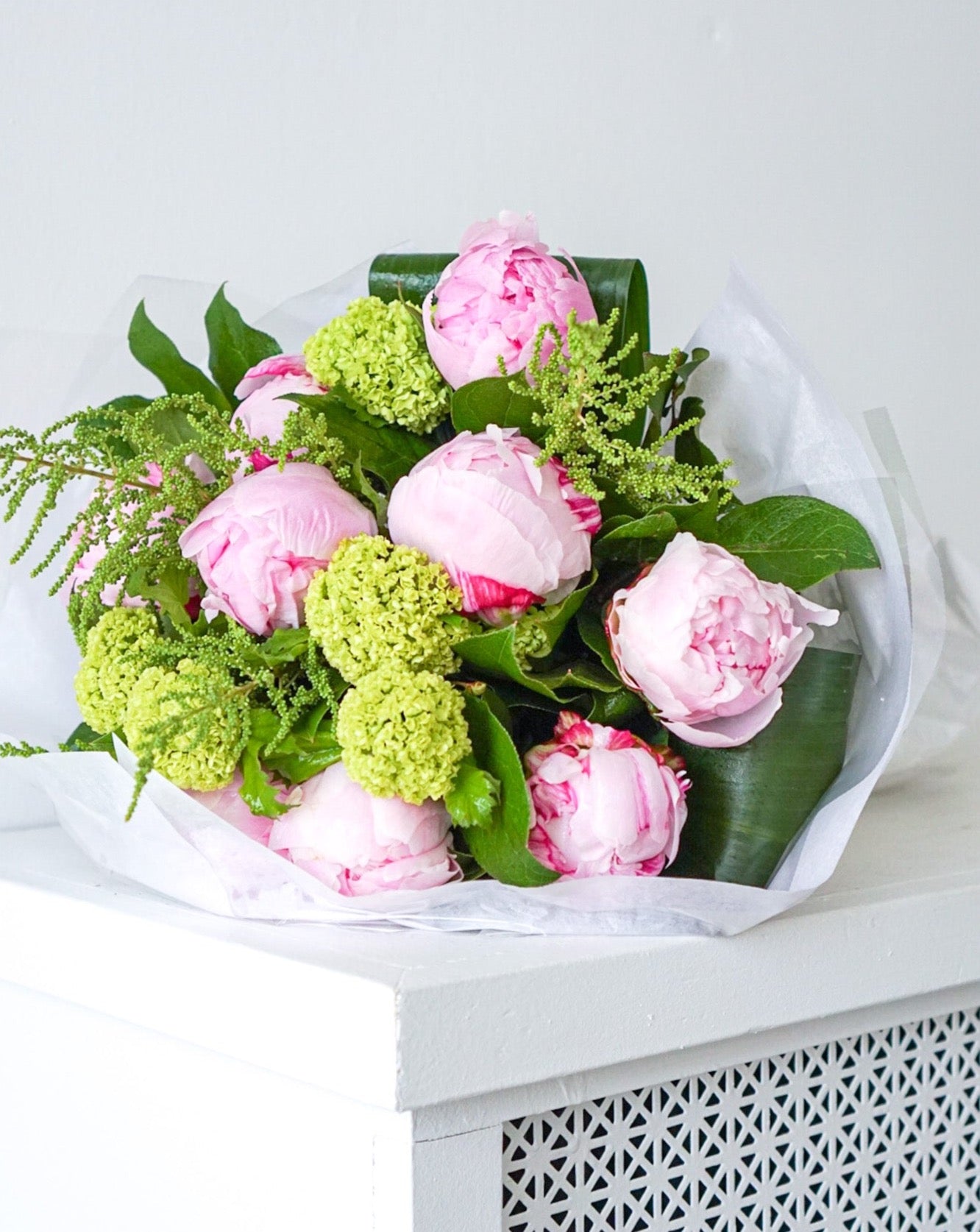 PEONIES are in season now and they are beautiful! Everyone loves the lush, cloud-like appearance of fresh cut peonies.  This simple bouquet of these lovely blooms is perfect gift for a friend or yourself.  We offer them in two styles:  Hand-tied bouquet that is ready to be pop into a vase at home Already designed in a fish bowl 